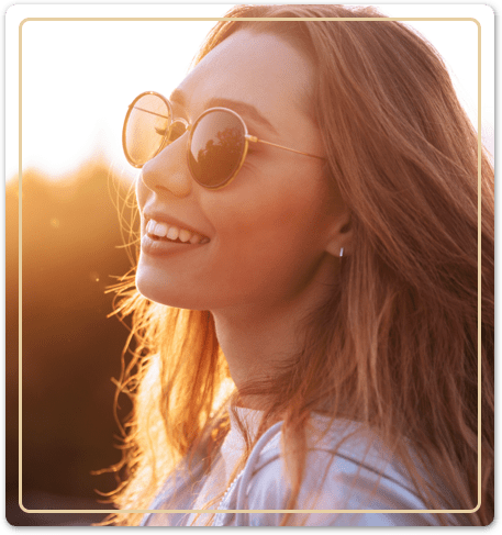 woman smiling wearing sunglasses